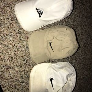 2 Nike hats and 1 adidas